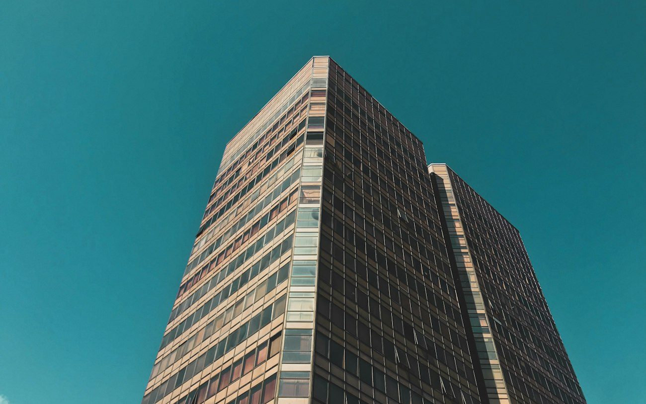 An office tower in Asunción against a blue sky.
